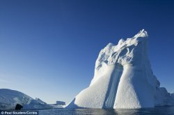 A new scientific paper has warned that melting of ice sheets in West Antarctica and Greenland may be happening 10 times faster than was previously predicted. This could lead to sea levels rise of up to 30 feet within 50 years, they warn. A picture of an iceberg which calved off from the Greenland ice sheet is pictured