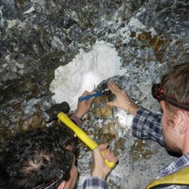 Graduate students measure a magnesite nodule