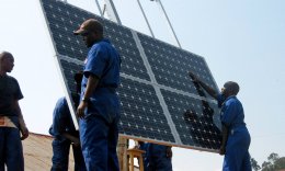 Training workers to properly install solar panels at health clinics in Rwanda provides clean energy and creates green jobs.